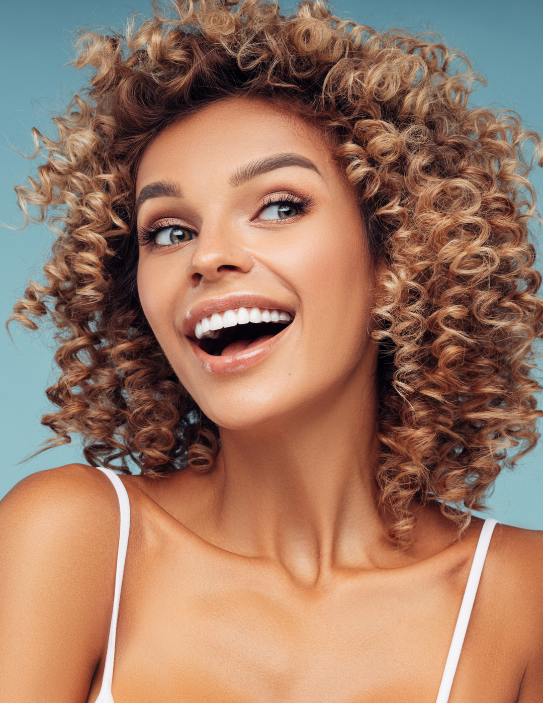 Curly hair lady smiling